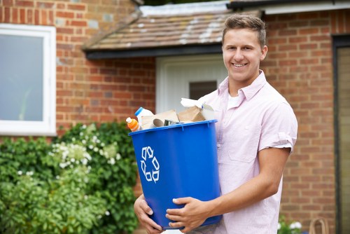 Professional waste clearance team handling construction debris